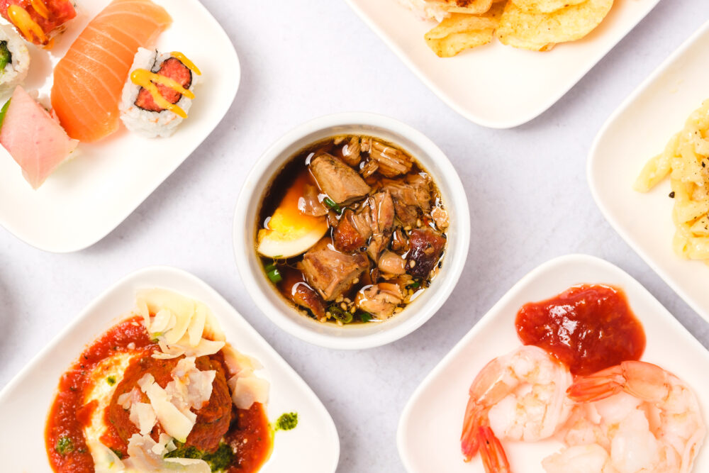 A group of plates with different types of food on them.