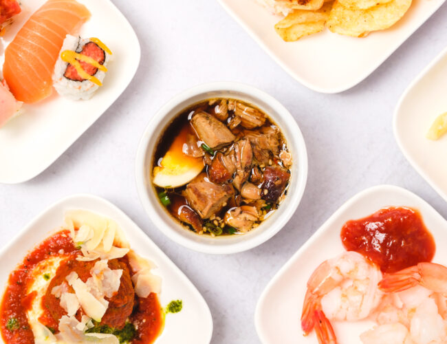 A group of plates with different types of food on them.