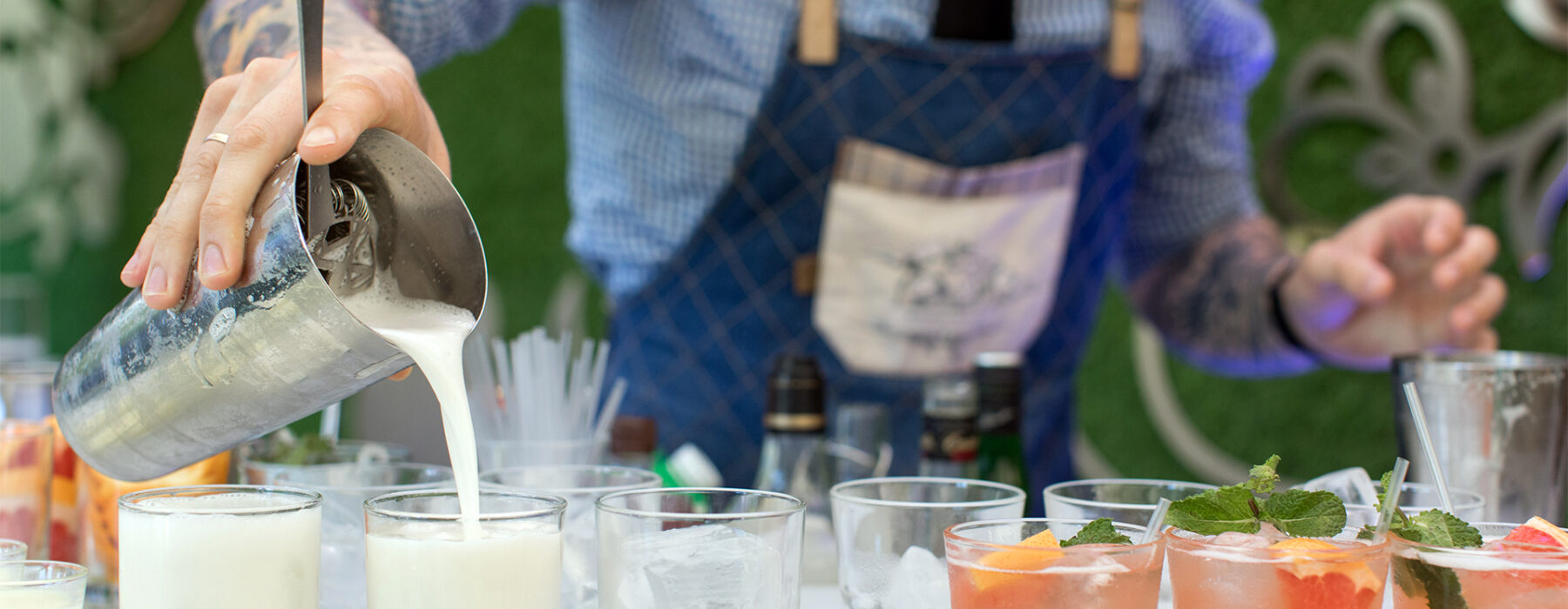 Bartender pouring drinks at party